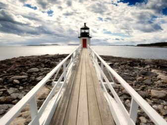 pier leading to lighthouse